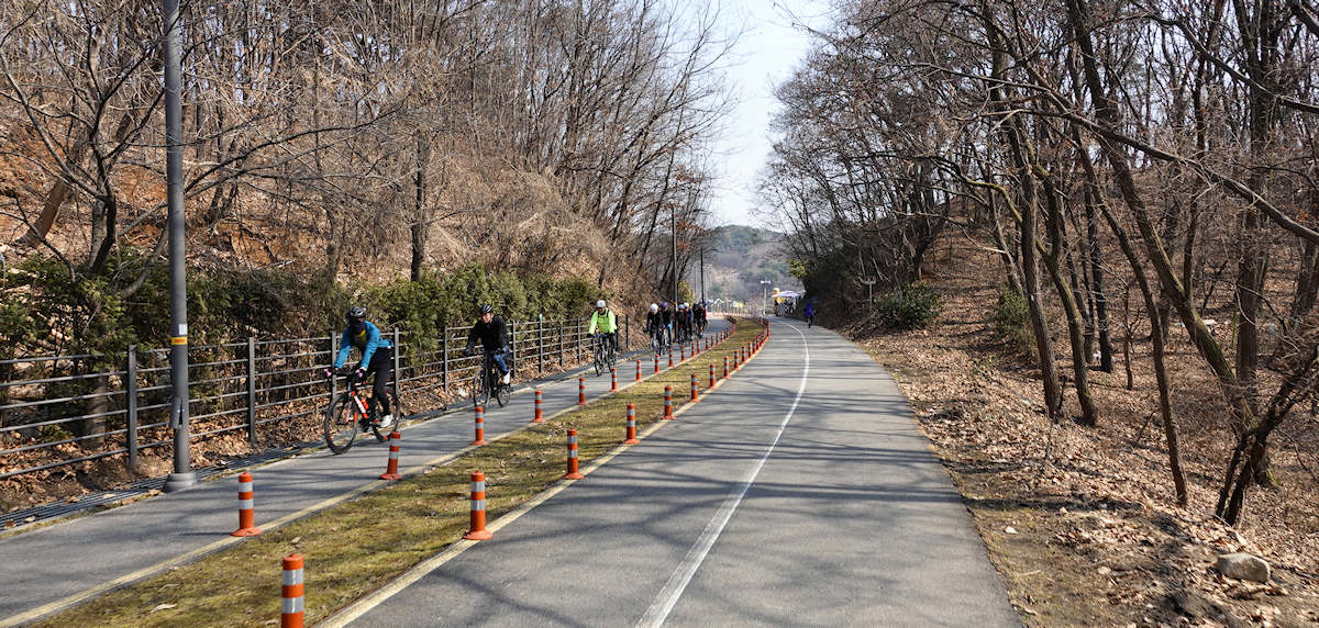 Masked Cyclists near the Paldang Dam at the Namhangang River